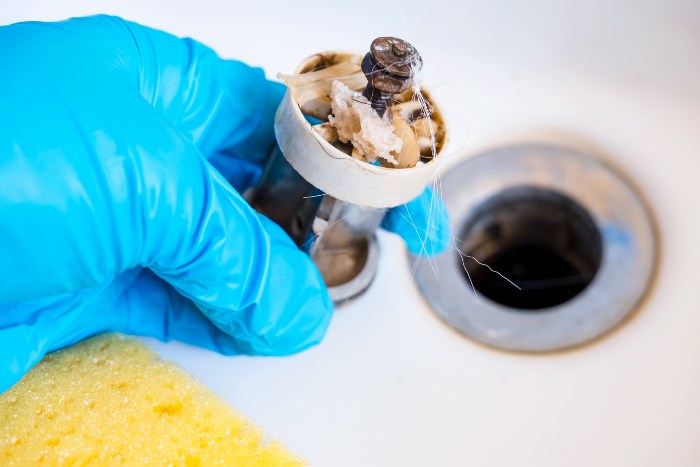 Expert plumber advice to fix a clogged garbage disposal safely and avoid further damage