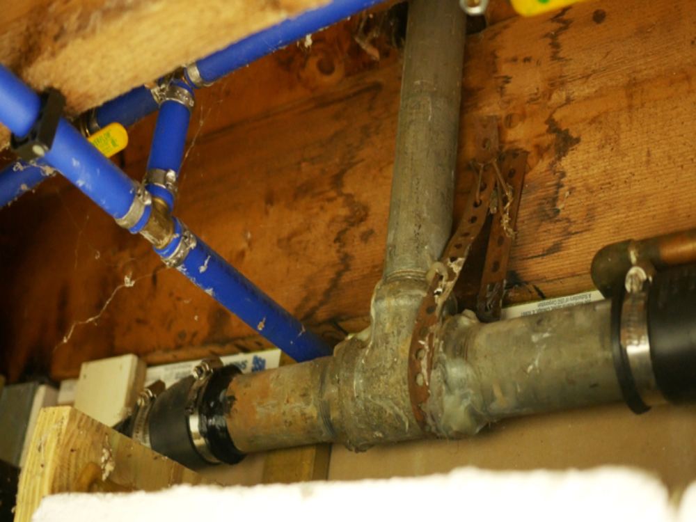 Residential galvanized metal vent pipes on a home rooftop