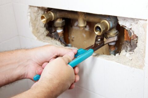 Water leaking from a shower fixture due to plumbing issues