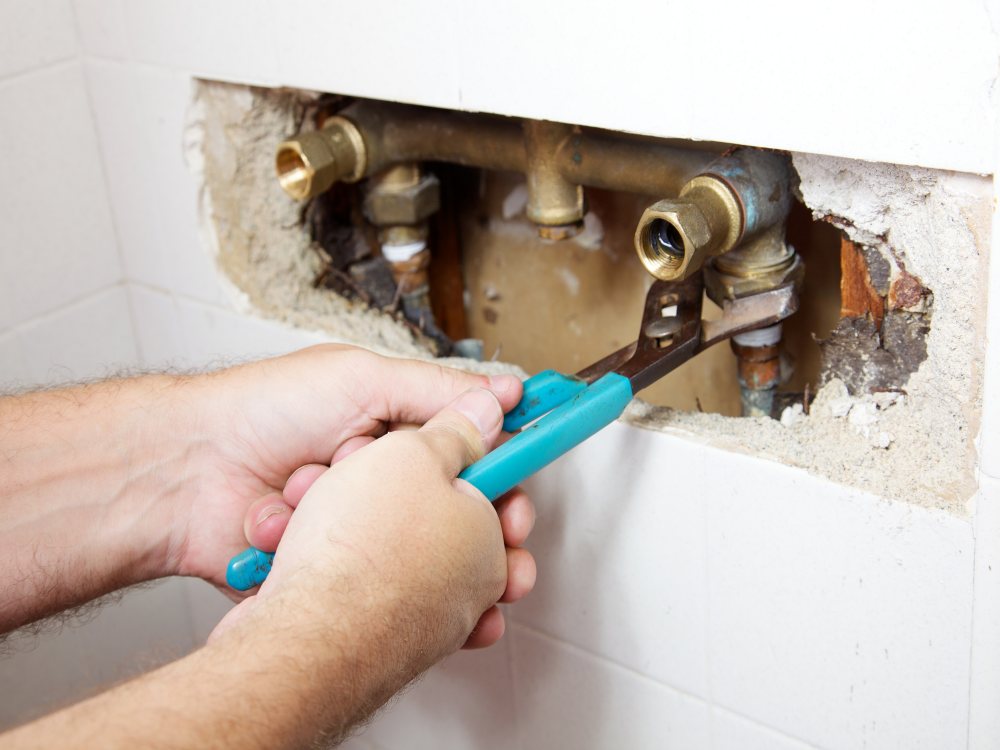 Water leaking from a shower fixture due to plumbing issues